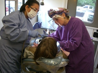 JCC grants story-image3-Providence MTI mobile dental Patient (reclined in dental chair) receives care from providers with mobile dental program run by Providence Health and Medical Teams International.